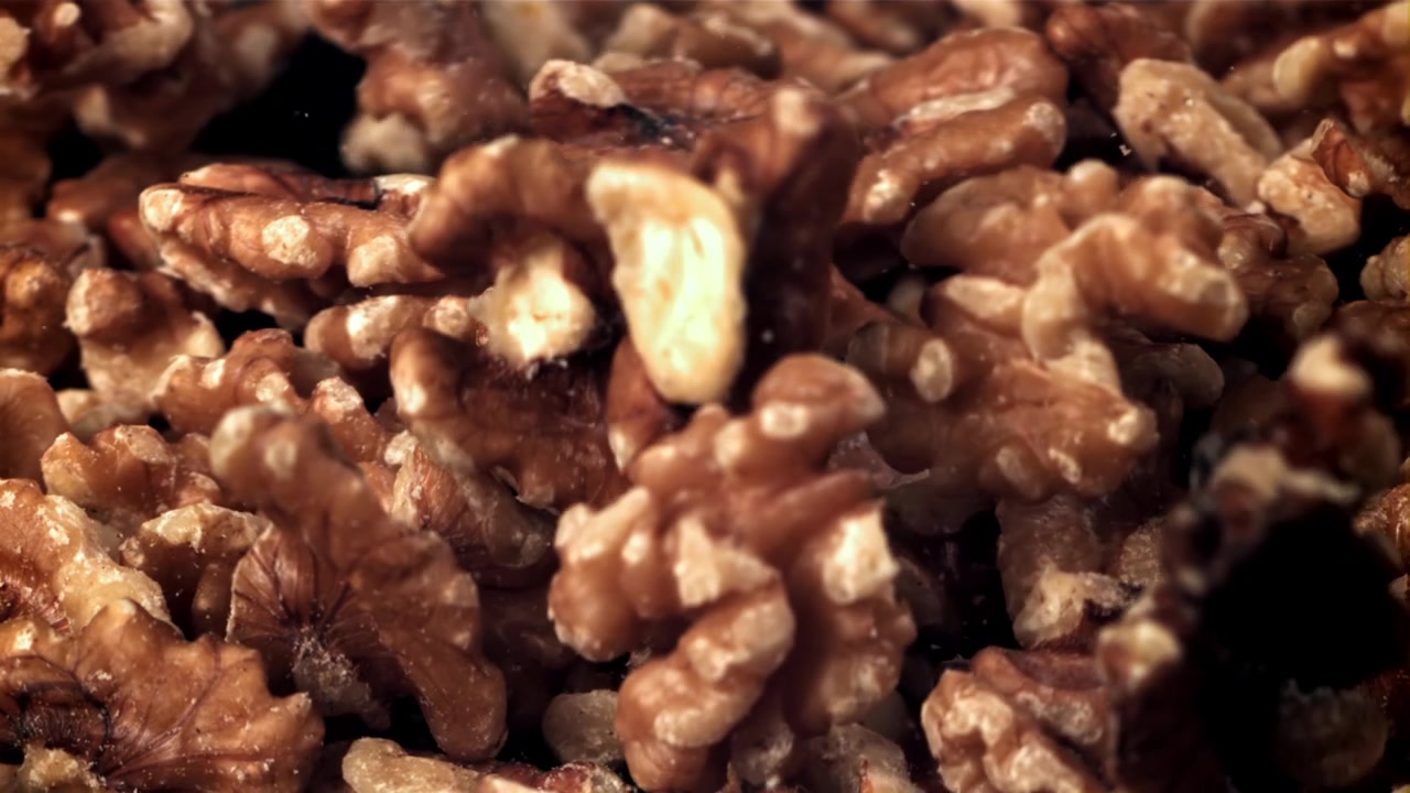 Close-Up of Walnuts Falling in Slow Motion