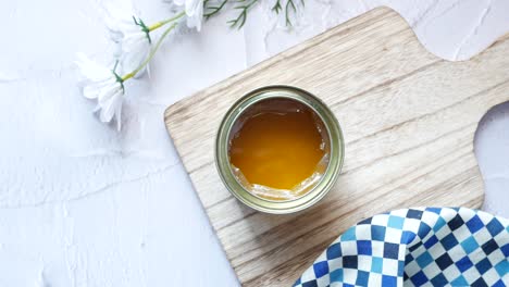 Homemade-ghee-in-container-on-a-table