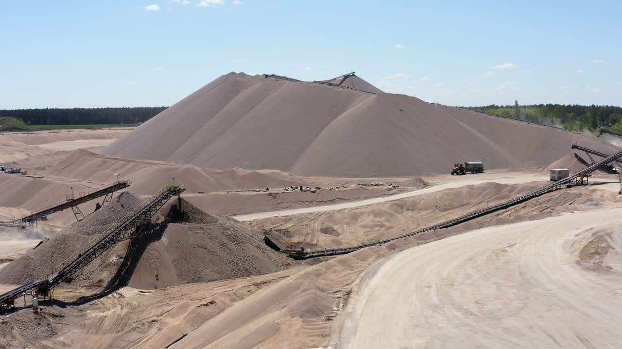 Quarry Site With Trucks, Conveyor Belt Systems And Crushers - Aggregate Extraction. - aerial shot