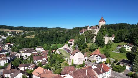 lucens municipality switzerland aerial drone medieval castle tower swiss vaud canton