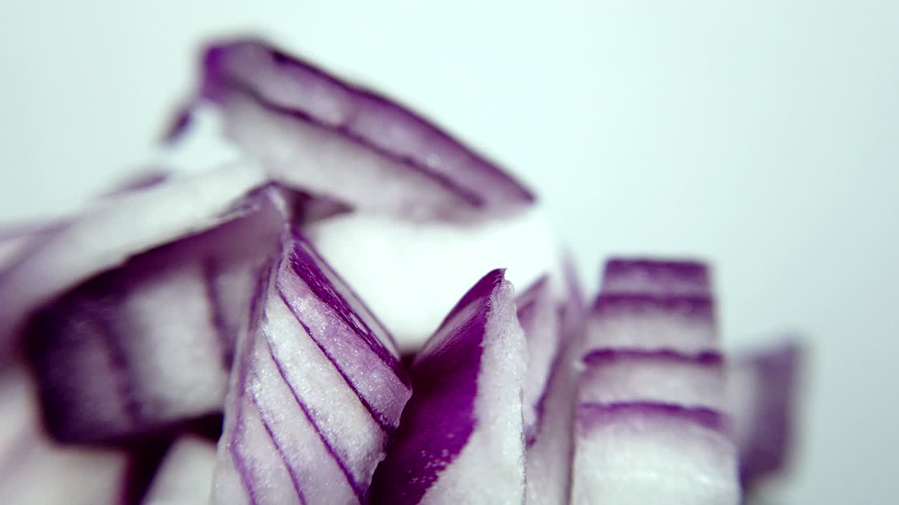 Sliced red onion in closeup, looping 360 macro video