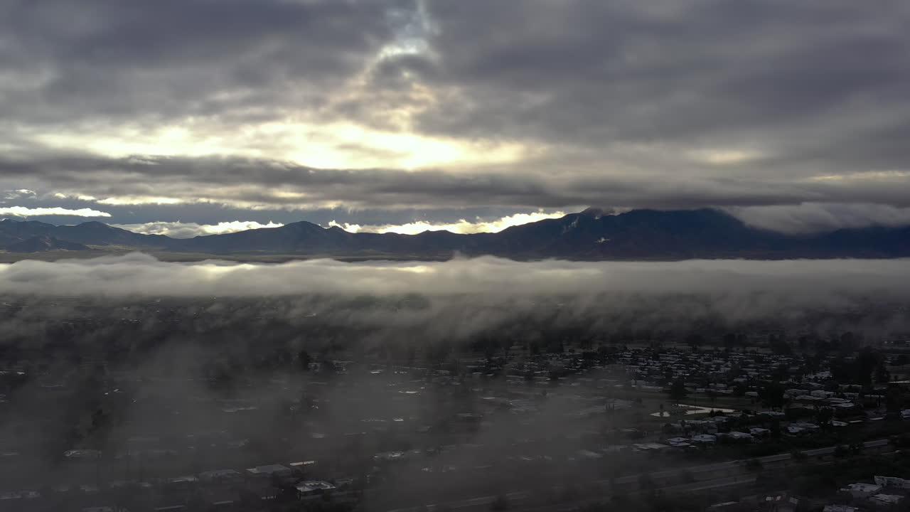 Slow moving drone shot of thick fog over Green Valley, Arizona USA