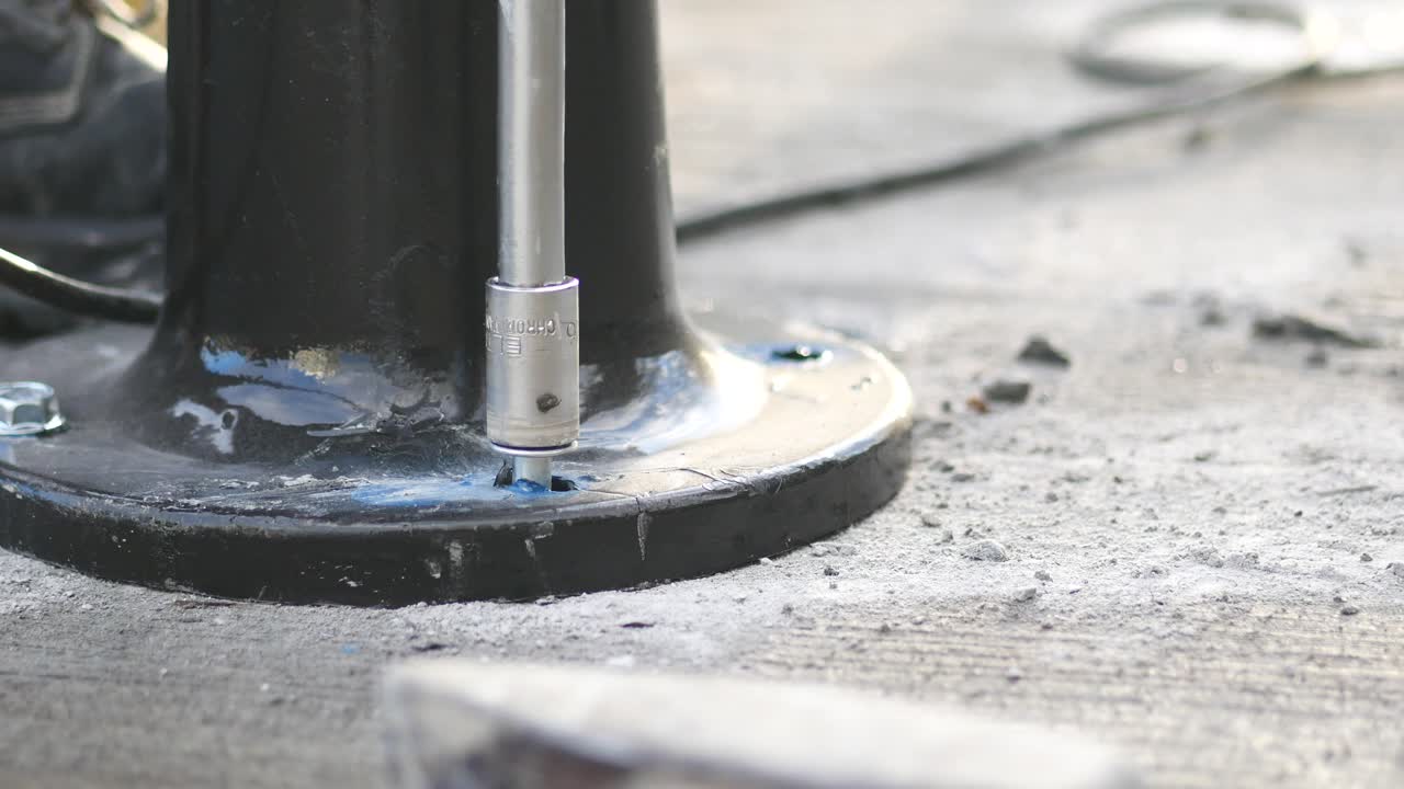 Installing a black metal base on concrete