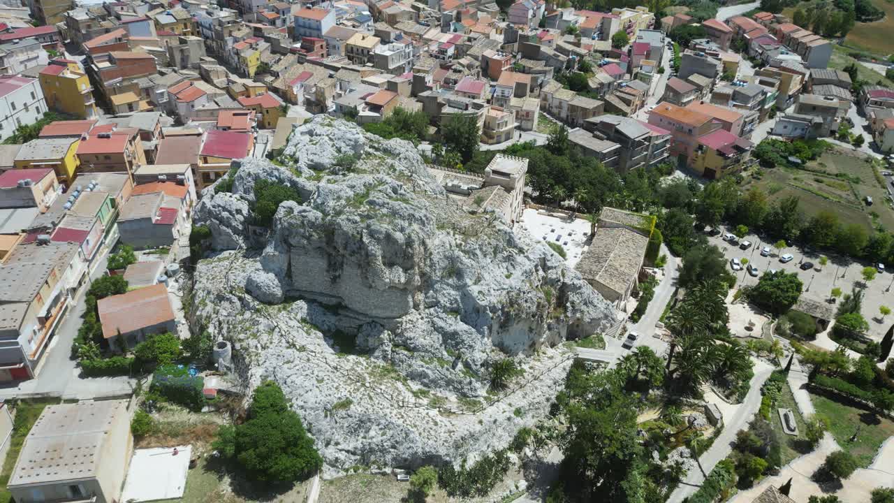Aerial drone footage of Joppolo Giancaxio, Sicily: peaceful hilltop village surrounded by countryside, olive groves, and rolling hills. Perfect for travel, culture, and documentary projects