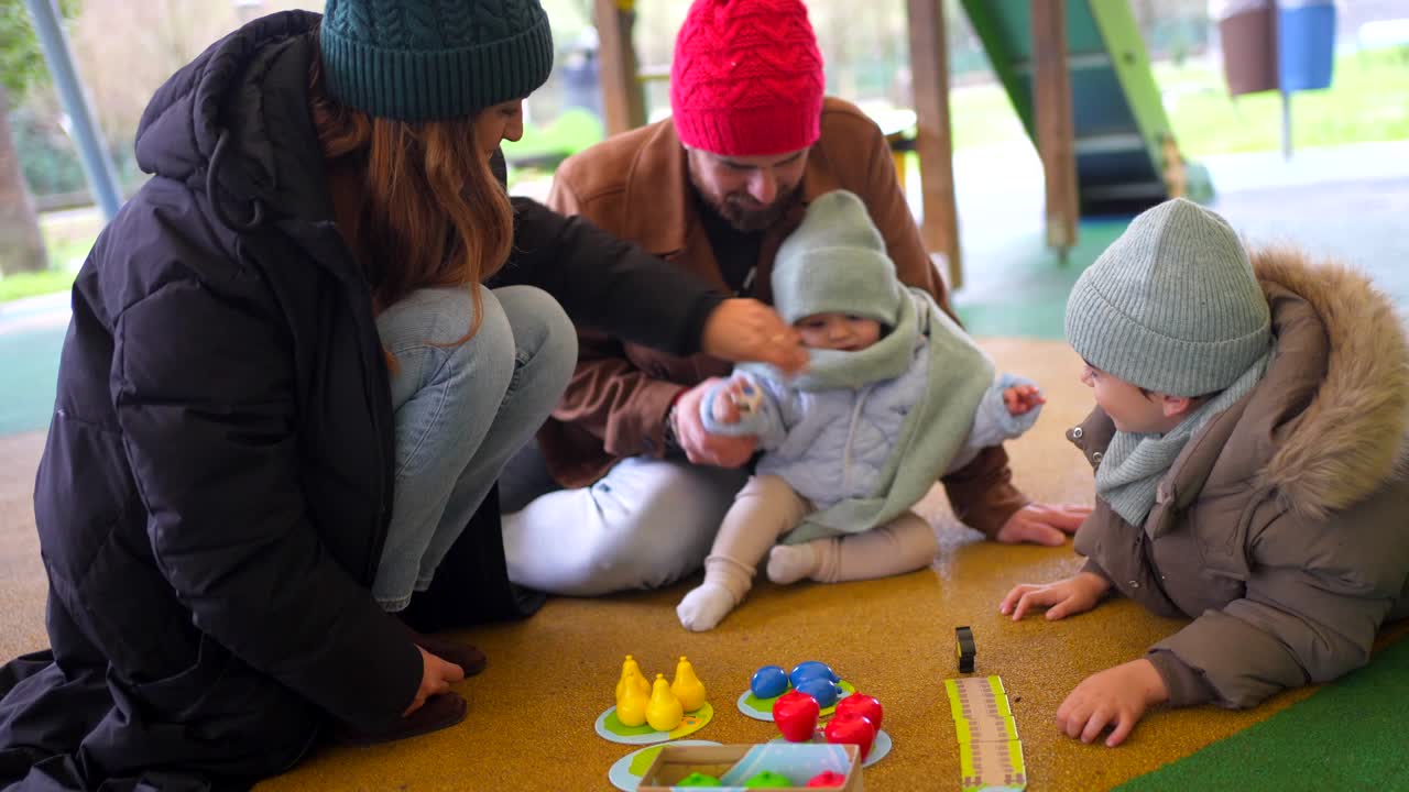 Family playing in a playground