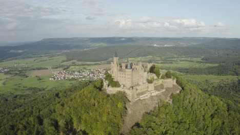 cinematic panning aerial establishing shot of hohenzollern castle located on the berg hohenzollern mountain