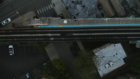 birds eye view of subway train crossing over street