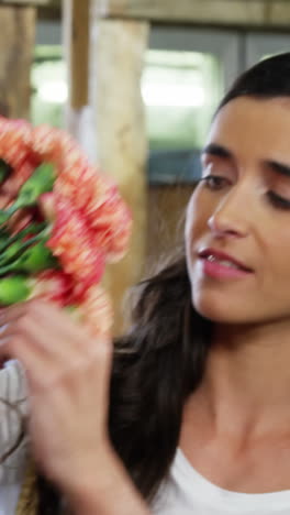 woman selecting a flower bouquet