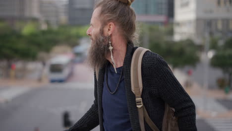 portrait mature bearded hippie man relaxing enjoying carefree urban lifestyle homeless beggar travel in city wearing backpack slow motion