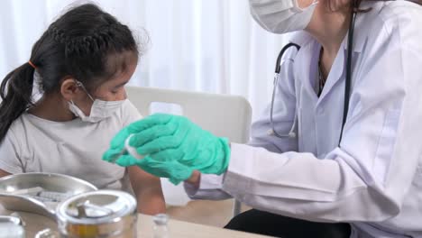 school girl visits skillful doctor at hospital for vaccination