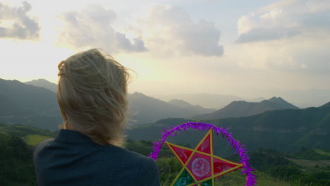 Slow-motion-shot-of-a-woman-holding-a-star-flare-during-the-mid-autumn-festival