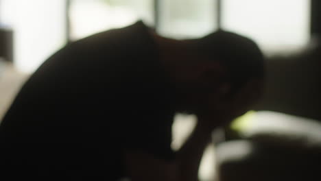blurry image of a person appearing stressed