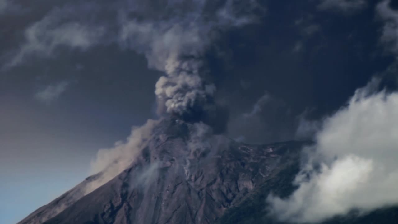 Timelapse of the Fuego Volcano erupting heavily, shooting pyroclastic material into the sky and covering its surrounding area in ash