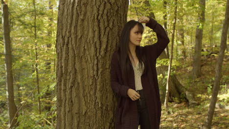 A petite, slender white girl with long straight black hair, and bangs