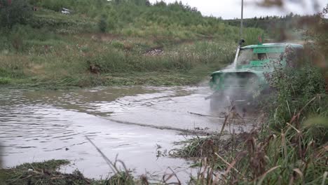 off-road vehicle crossing a muddy river