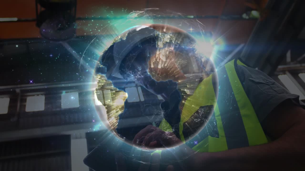 Engineer viewing emerging globe overlaying chest, tapping tablet for real-time industrial insights