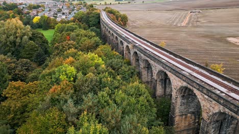 drone aerial footage of the penistone viaduct a curved railway viaduct which carries the railway over sheffield road and the river don