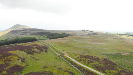 Haze-over-Lomond-Hills-highland-in-Scotland-with-road-and-rock-wall