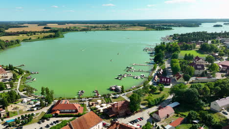 aerial view of a picturesque lake town with marina and boats