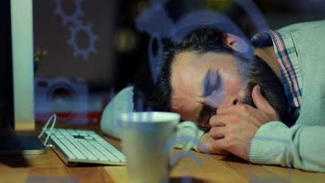 animation of technology icons over biracial man sleeping at desk with computer