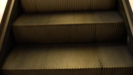 escalator steps moving in a shopping mall