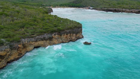 Santa-Cruz-beach-cliffs-in-Westpunt-Curacao-bombarded-by-strong-churning-ocean-waves-from-big-storm-swell