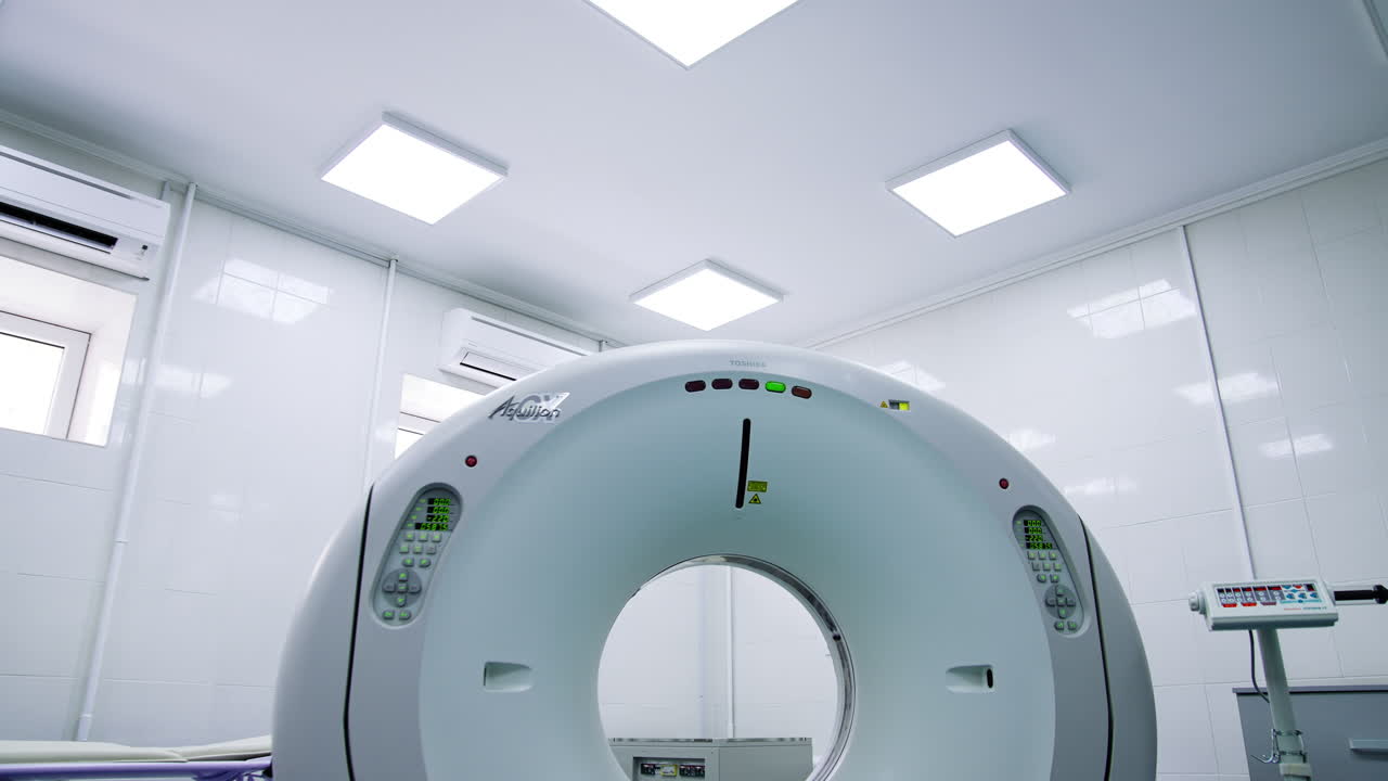 Empty hospital room with tomography machine in the middle. Magnetic resonance imaging machine. Low angle view.