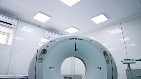 empty hospital room with tomography machine in the middle. magnetic resonance imaging machine. low angle view.