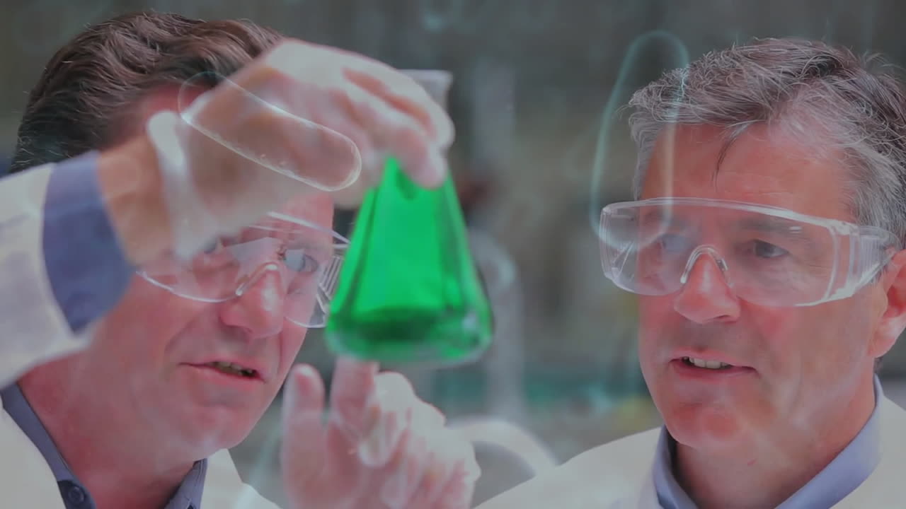 Animation of virus cells over caucasian male scientists working in lab