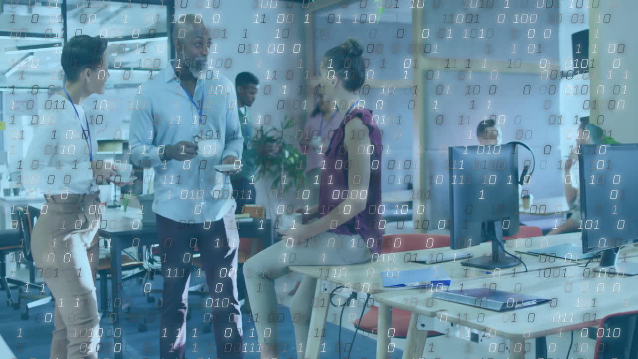 three coworkers chatting and holding coffee mugs in technology office, with binary code overlay