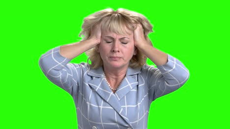 desperate mature woman on green screen.