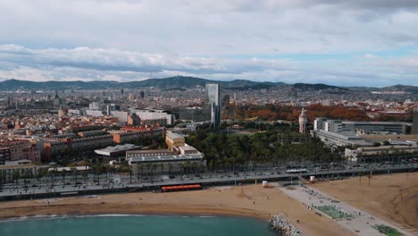 barceloneta drone epic beach view city at the background with colorful nature and urbanism modern art 4k footage barcelona, spain