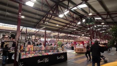 shoppers explore stalls at melbourne's queen victoria market