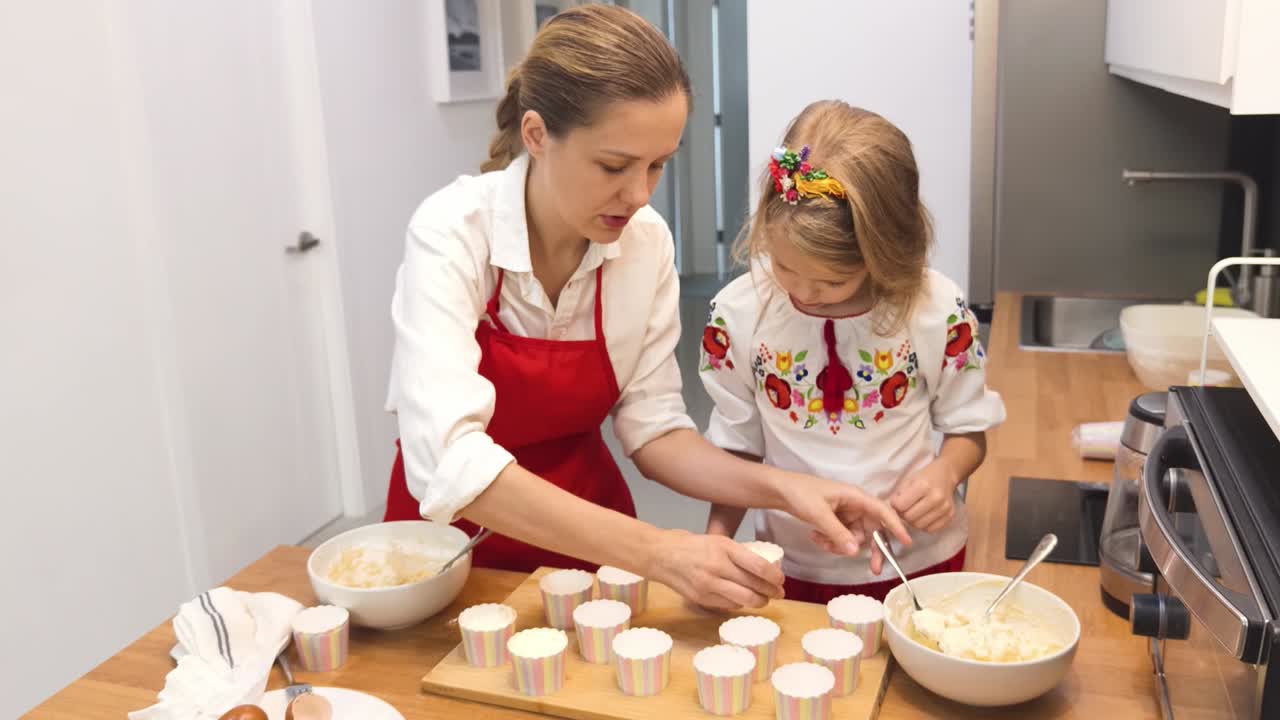Mother and Daughter Baking Cupcakes