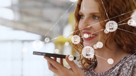 Animation-of-network-of-connected-icons-in-circles-over-happy-caucasian-woman-using-smartphone