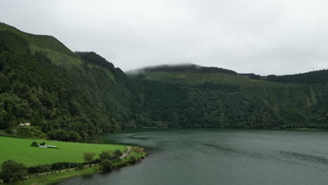 Flying-over-Lagoa-Azul-in-Sao-Miguel-island-of-the-Azores-on-a-misty,-moody-day