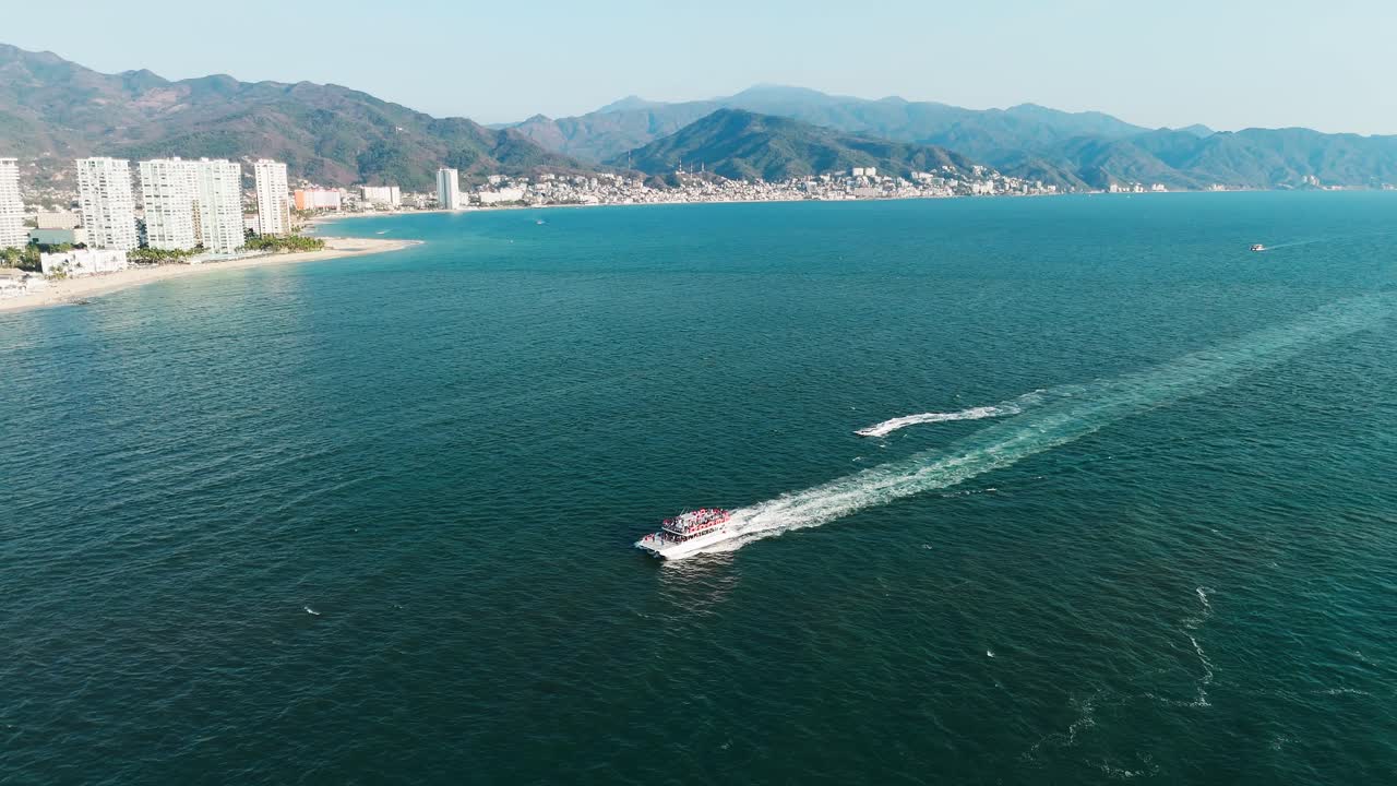 Panoramic view of yachts cruising in the sea with the city in the background, puerto vallarta mexico