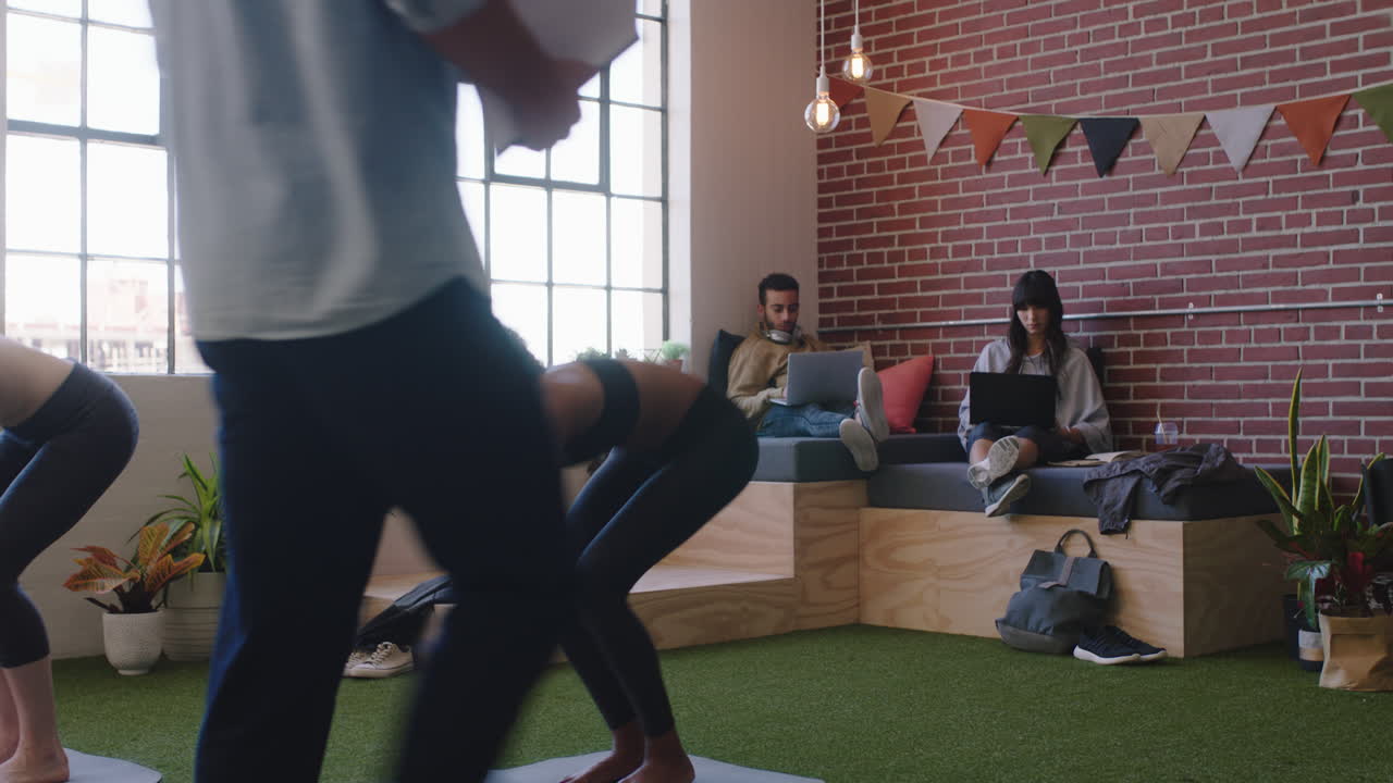 young multi ethnic business students working together team leader businessman sharing ideas colleagues doing yoga relaxing in modern office workplace
