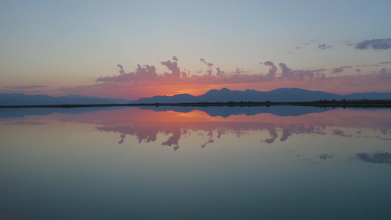 Aerial view of a swamp oasis in the mexican desert of cuatro cienegas in Coahuila. Sky with clouds reflected on water. RAMSAR protected area.