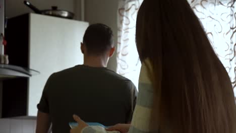 couple interacting in a kitchen