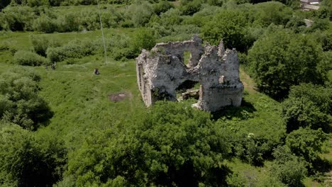 stone walls of ancient castle ruins in ukraine countryside, aerial