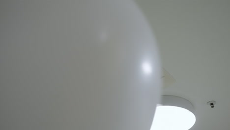 ceiling-mounted air conditioner, light, and balloon