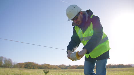 manager, wearing personal protective clothing surveying outdoor area