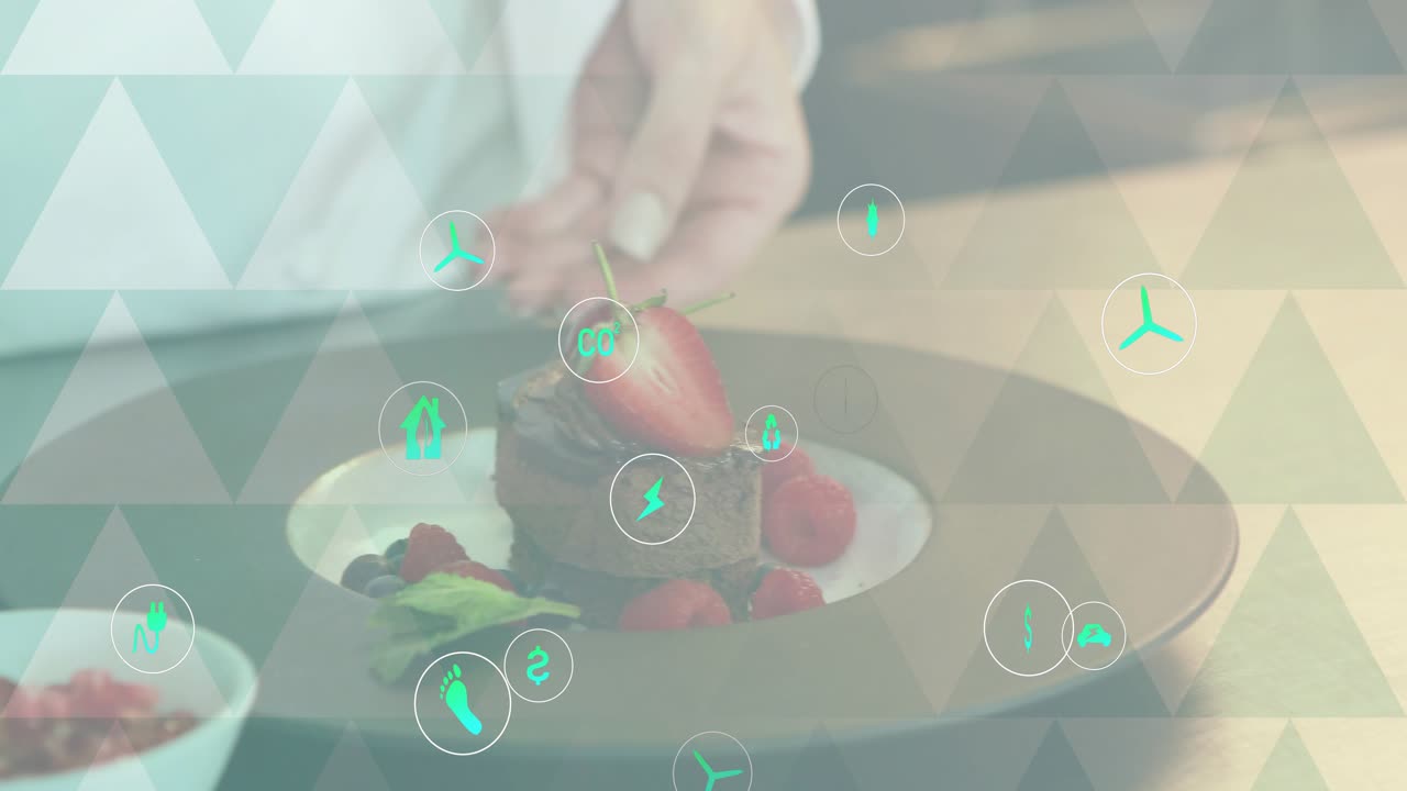 Chef garnishing cake with strawberry mint, stepping back, initiating teal icons showing energy cost
