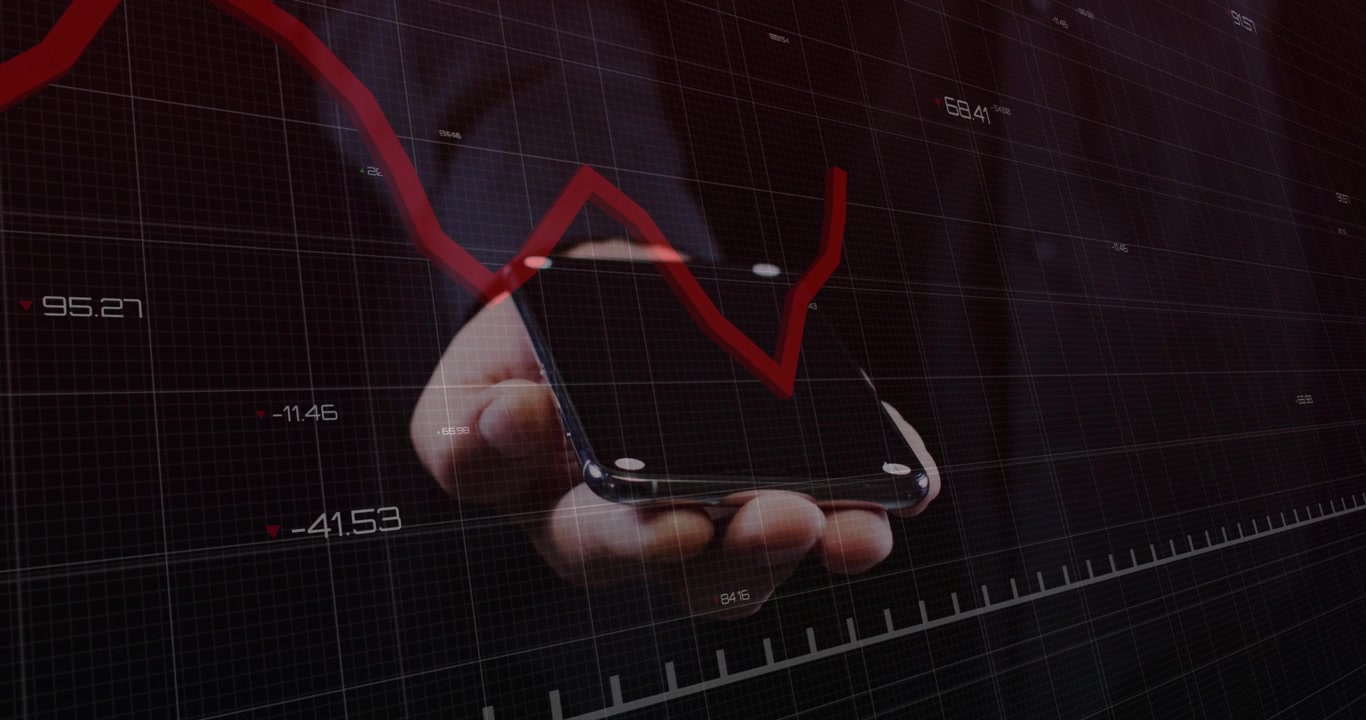 Man holding phone in hand while red finance graph appearing from left crossing grid showing decline