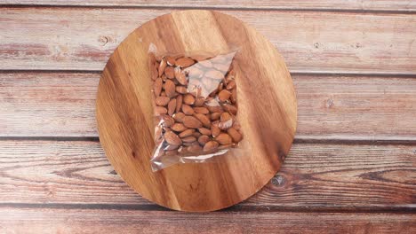 top view of almond nut in a plastic packet on table