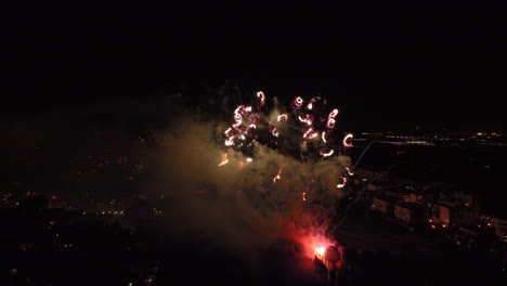 Elevated-capture-of-Montpellier's-cityscape,-adorned-with-a-radiant-pyrotechnic