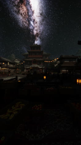 starry night sky over traditional japanese temple complex