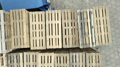 Top-down-shot-of-wooden-pallets-stack-in-the-warehouse