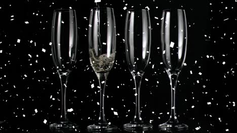 Animation-of-falling-confetti-over-champagne-getting-poured-in-flute-glass-against-black-background